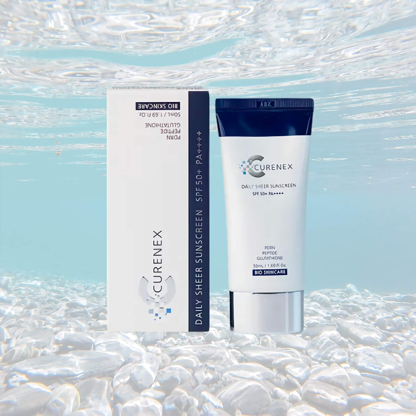 Curenex Salmon DNA Sheer Sunscreen SPF50+ PA++++ in 50ml tube and box against a watery backdrop.