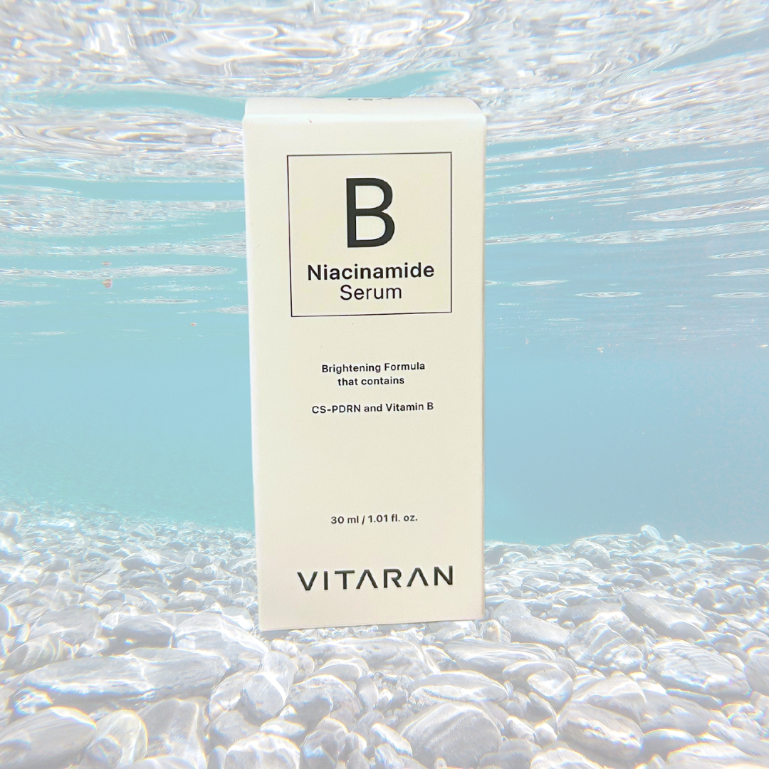VITARAN B Salmon DNA and Niacinamide Serum 30ml brightening ampoule under water.
